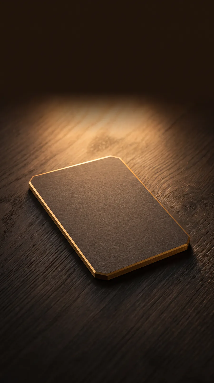 A gold-edged card resting in warm light
